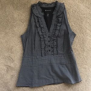 Side zip blouse. Flares at waist.